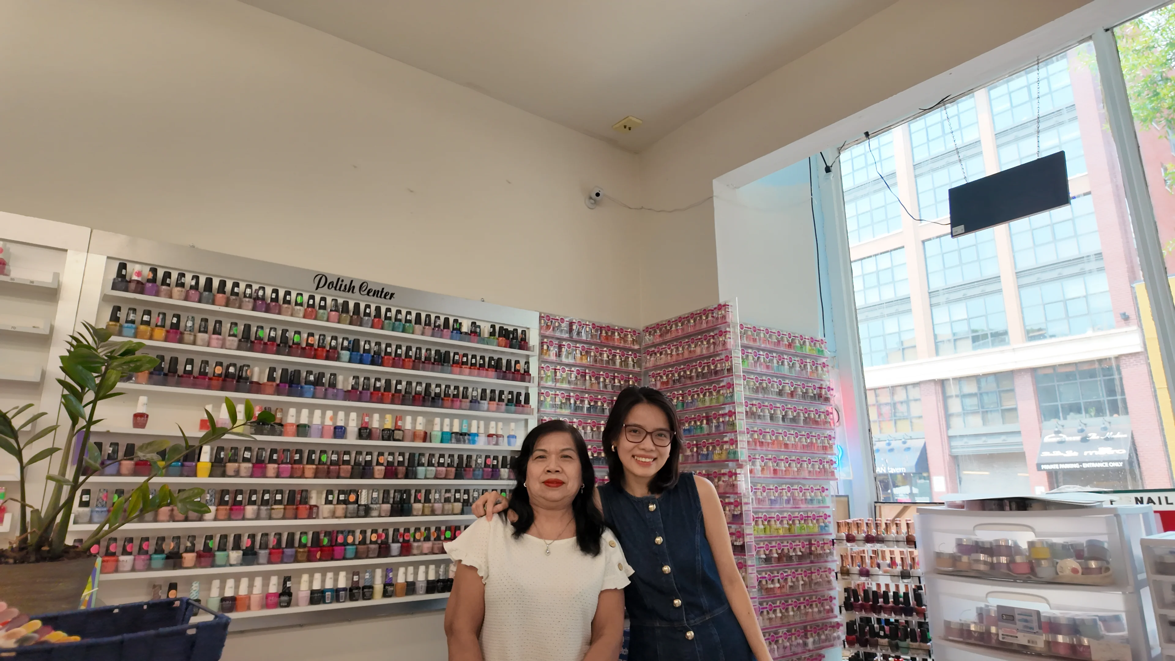 Linh, BlueBirds Pay founder, with a nail salon owner